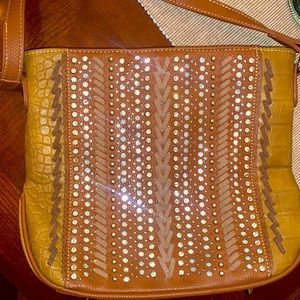 Women’s brown leather handbag.